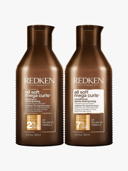 Redken All Soft Mega Curls Shampoo and Conditioner in branded components on a light gray background